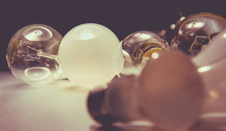 Bright light bulb , isolated in black background