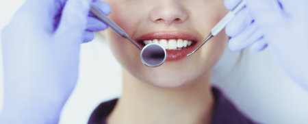 Dentist and patient sitting in dentist office