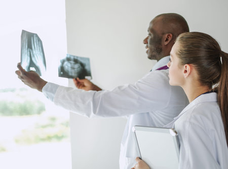 Doctors analyzing an x-ray in a meting. Doctors