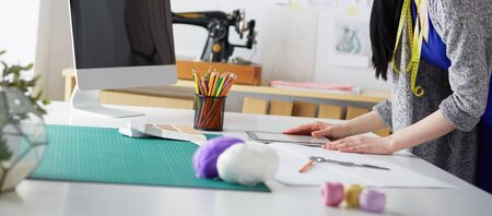 Portrait of Fashion designer working in her studioの写真素材