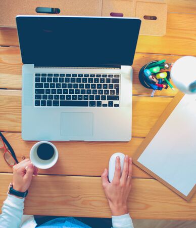 Young female working sitting at a deskの写真素材