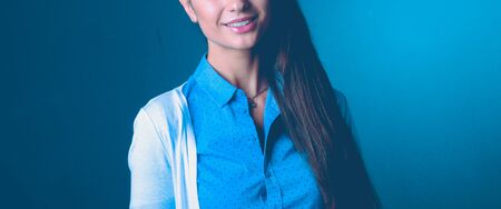 Portrait of a businesswoman , against dark backgroundの写真素材