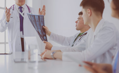 Medical team sitting and discussing at table