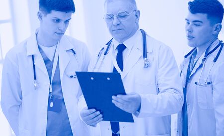 Successful medical team. Confident doctors team standing together and smilingの写真素材