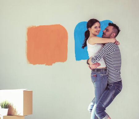 Happy young couple moving in new house. young coupleの写真素材