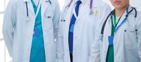 Successful medical team. Confident doctors team standing together and smiling.の写真素材