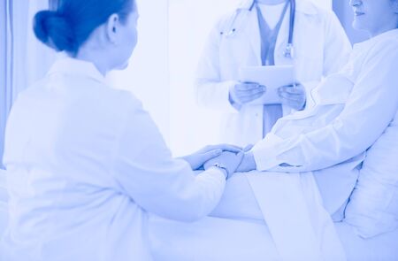doctor explaining diagnosis to her female patient.の写真素材