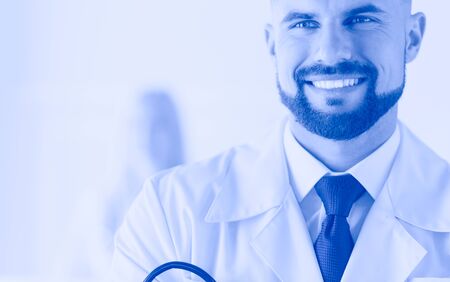Young and confident male doctor portrait. Successful doctor career conceptの写真素材