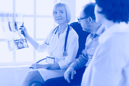 Doctor woman explaining x-ray results to patient