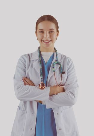Smiling medical doctor woman with stethoscope. Isolated over white backgroundの写真素材