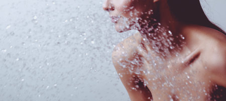 Young beautyful woman under shower in bathroom