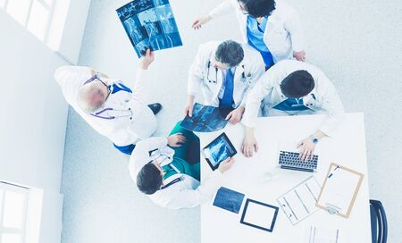 Medical team sitting and discussing at table, top view.の写真素材