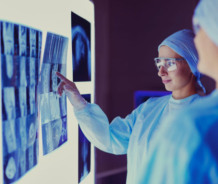 Image of attractive woman doctor looking at x-ray results