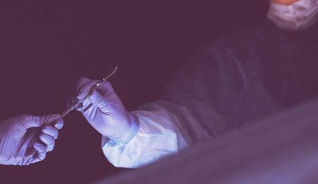 Cropped picture of scalpel taken doctors performing surgery.の写真素材