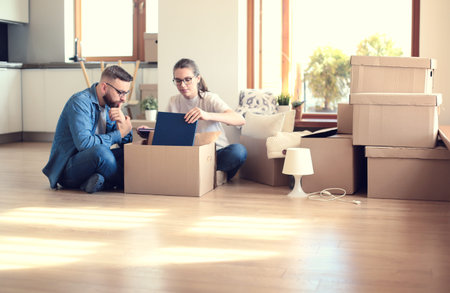 Young couple moving in to new home together