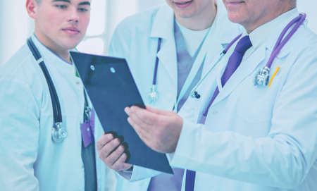 Successful medical team. Confident doctors team standing together and smilingの写真素材