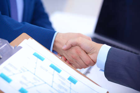 Business people shaking hands, finishing up a meetingの写真素材
