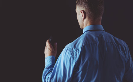 Businessman speech concept, talking with microphone in conference hall