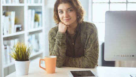 Beautiful smiling female student using online education service