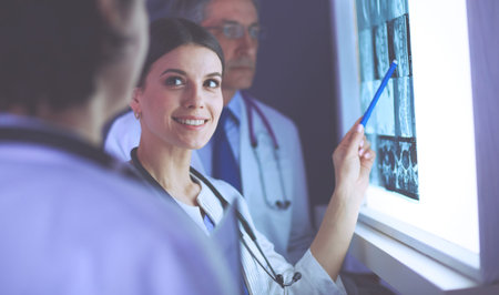 Group of doctors in a hospital. X-ray diagnostics.
