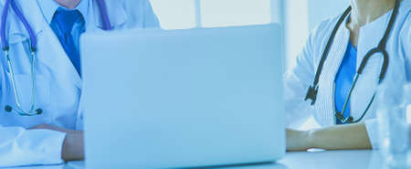 Serious medical team working in a bright officeの写真素材