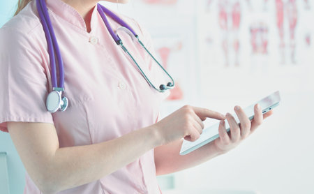 Doctor woman checking medical data on tablet pc