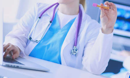 Two young female doctors at medical laboratory with tests.の写真素材
