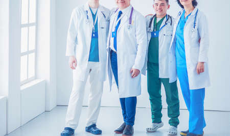 Successful medical team. Confident doctors team standing together and smilingの写真素材
