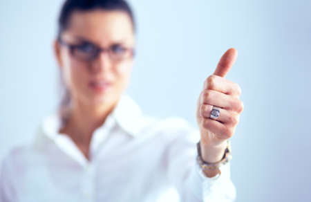 A young woman showing ok, isolated on white backgroundの写真素材