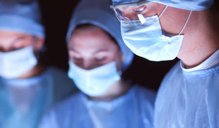 Team surgeon at work in operating roomの写真素材