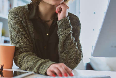Beautiful smiling female student using online education serviceの写真素材