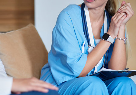 Woman doctor explaining diagnosis to her female patient