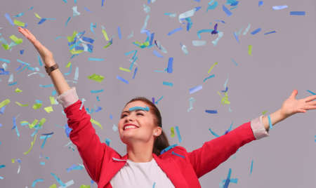 Portreit beautiful happy woman at celebration party with confetti .Birthday or New Year eve celebrating concept.の写真素材