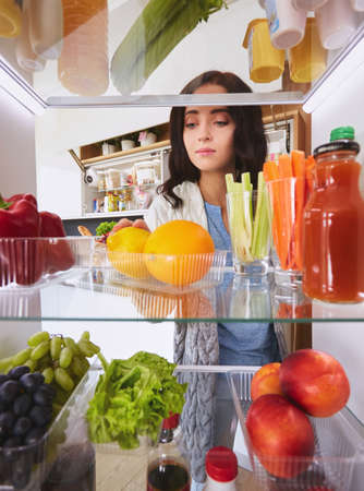 Open refrigerator with fresh fruits and vegetable. Open refrigeratorの写真素材