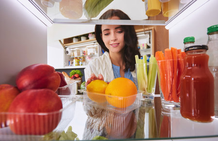 Open refrigerator with fresh fruits and vegetable. Open refrigeratorの写真素材
