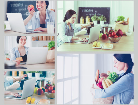 Smiling woman online shopping using computer and credit card in kitchen