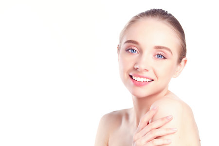 Portrait of beautiful woman with natural make up touching her face.の写真素材
