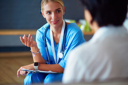 Female doctor hand hold silver pen filling patient history list at clipboard padの写真素材