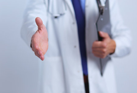 Friendly male doctor with open hand ready for huggingの写真素材