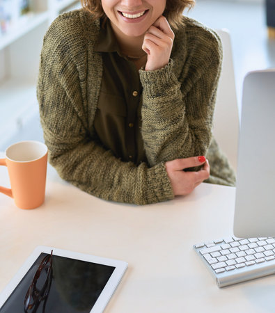 Beautiful smiling female student using online education serviceの写真素材