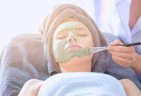 Beautiful woman having mask , lying on spa . Woman. Spa salonの写真素材