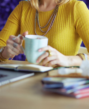 Young woman holding credit card and using laptop computer. Online shopping conceptの写真素材