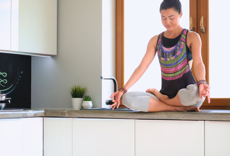 Fit and attractive young woman preparing healthy meal. Woman.の写真素材