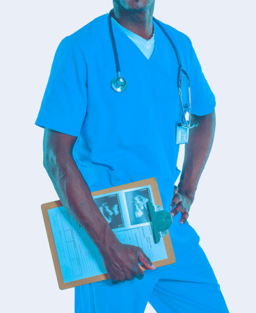 Male doctor standing with folder, isolated on white background. Doctor. Clinic.の写真素材