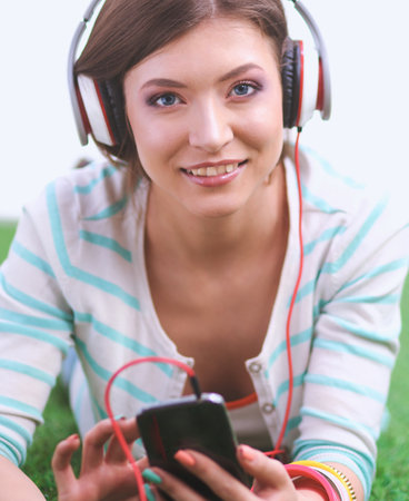 Young woman listening to the music . Young womanの写真素材