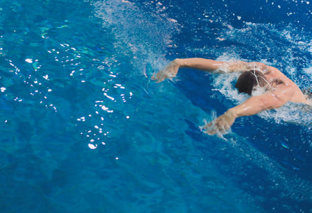 Male swimmer at the swimming pool. Underwater photo. Male swimmer.の写真素材