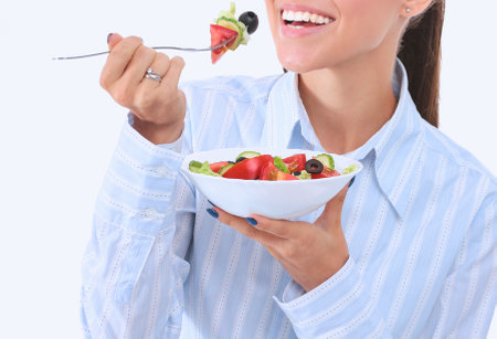 A beautiful girl eating healthy food. Beautiful girlの写真素材