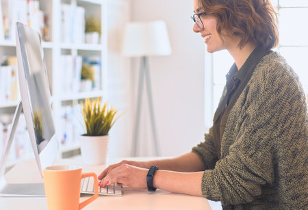 Young woman or student using tablet computer at homeの写真素材