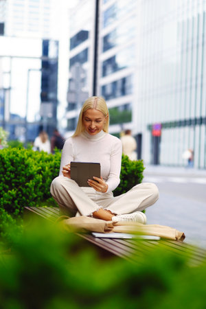 Calm business woman meditating in lotus outdoorsの写真素材
