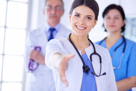 Female doctor offering a handshake in the hospitalの写真素材